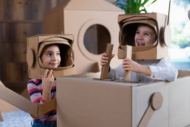 istock Children playing role play game as astronauts on mars. 1787685634