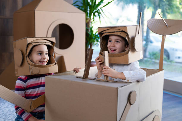 istock Children playing role play game as astronauts on mars. 1787687036