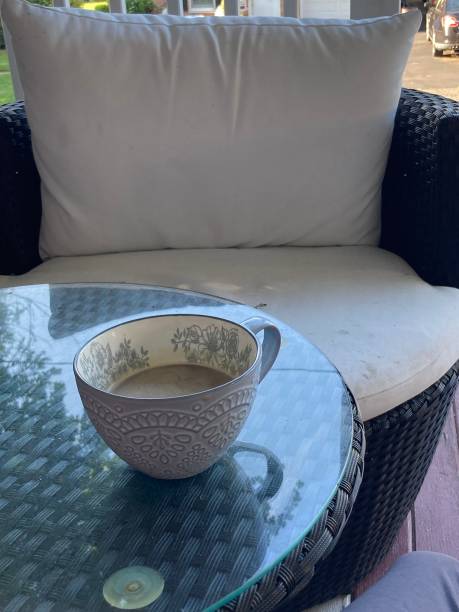 istock Coffee cup on outdoor table in the morning 1787687393