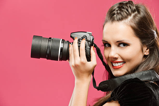 istock Woman-photographer hold in hands DSLR 178768769