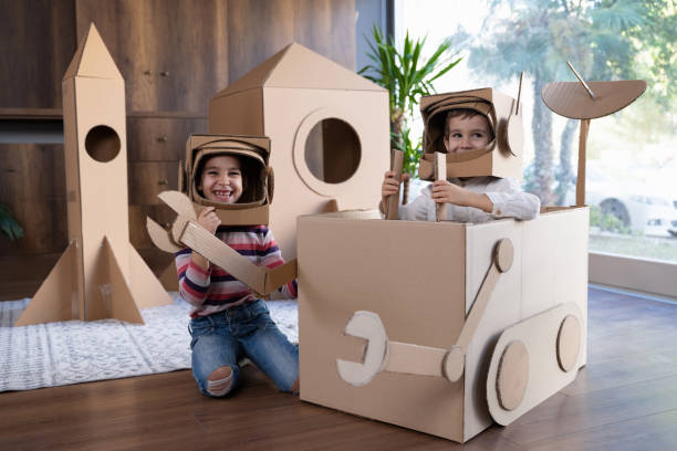 istock Children playing role play game as astronauts on mars. 1787688169
