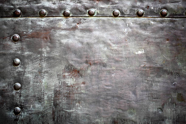 istock Black metal plate or armour texture with rivets 178769096