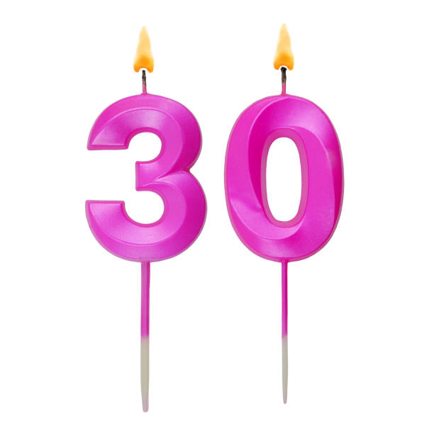 istock Pink birthday candles isolated on white background, number 30 1787693662