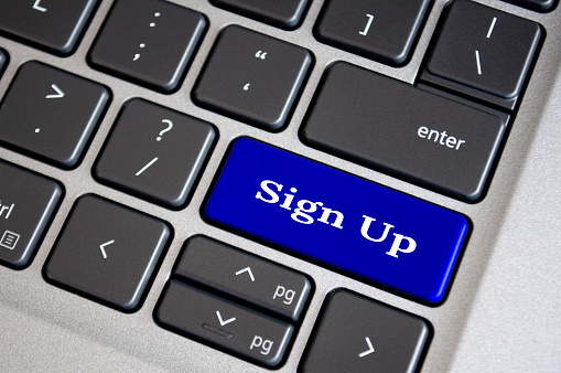 Sign up text on blue keyboard. Sign up and online registration concept
