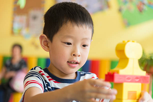 istock asian boy playing with toy 178769423
