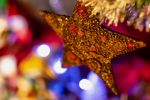 Gold star on christmas tree, decoration and ornament, celebration spirit