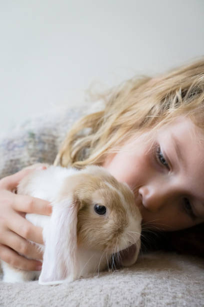 istock Cute girl with rabbit 1787694868