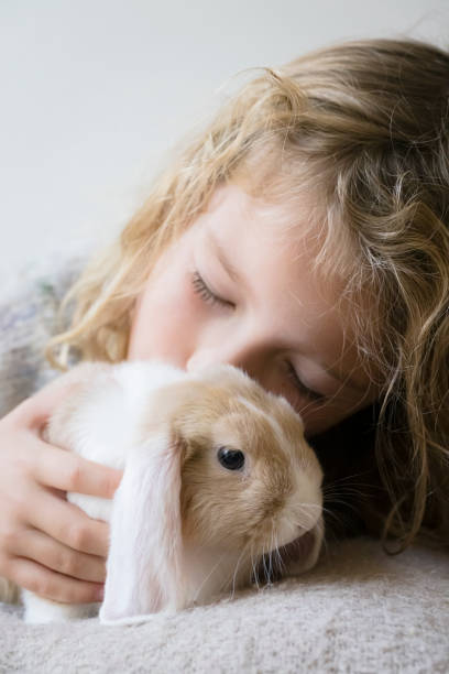 istock Cute girl with rabbit 1787694869