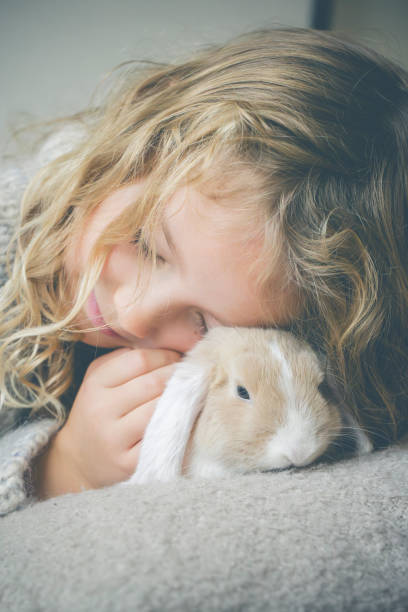 istock Cute girl with rabbit 1787694871