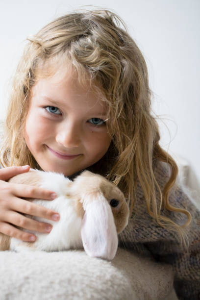 istock Cute girl with rabbit 1787694938