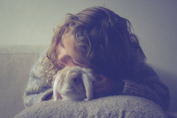 istock Cute girl with rabbit 1787694956