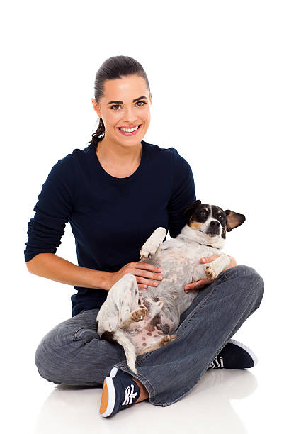 istock pretty woman holding pet dog 178769526