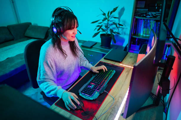 istock Happy woman playing video games on computer 1787695305