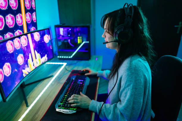 istock Happy woman playing video games on computer 1787695528