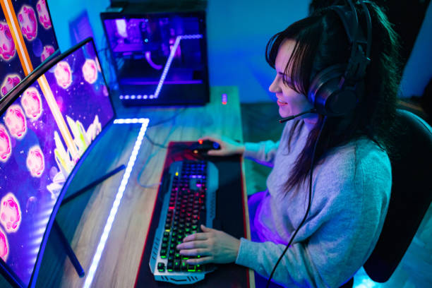 istock Happy young woman playing a video game 1787696971