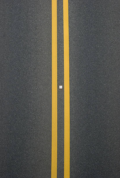 istock double yellow lines divider on blacktop 178769707