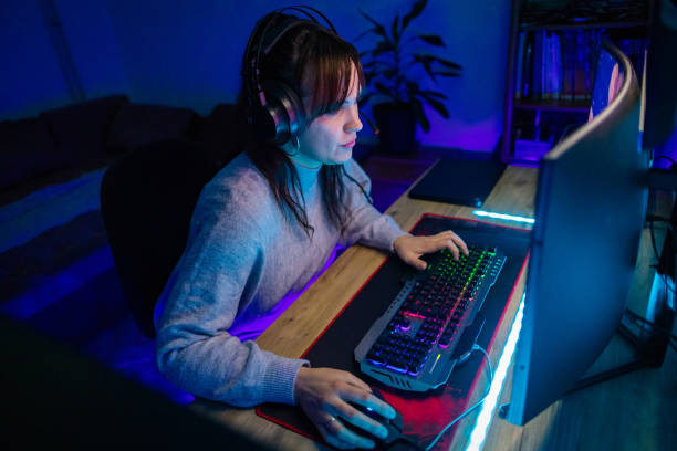 istock Young woman playing video game 1787697280