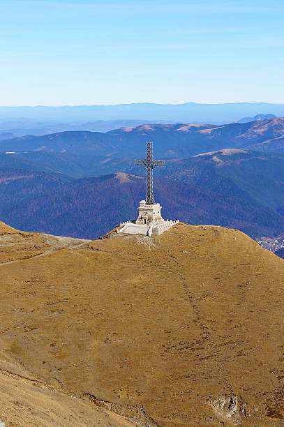 Caraiman heroes cross monument in Bucegi mountains Romania stock photo