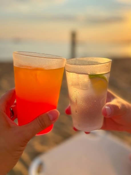 istock Cheers, toast on the beach with cocktails in plastic cups 1787700074