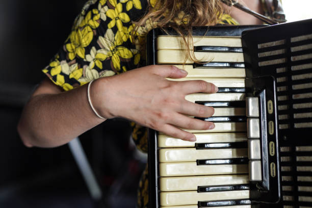 istock A girl playing the accordion 1787701592