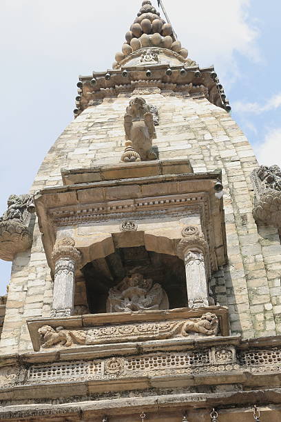 Detail of the upper levels of the stone made shikhara style Vatsala Durga hindu temple in the Durbar Square of Bhaktapur-Kathmand Valley-Nepal.