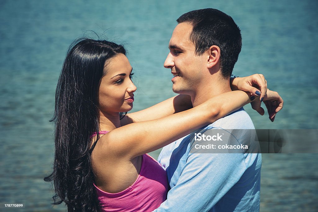 young couple in hug young couple in hug on the beach Beach Stock Photo