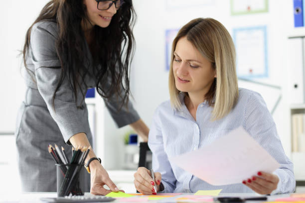 Businesswoman brought documents for signature to boss. Businesswoman brought documents for signature to boss. Signing and planning business ideas concept delegating stock pictures, royalty-free photos & images