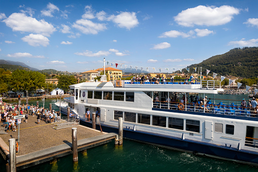 Holidays in Italy - scenic view of the tourist ferry in the port of Garda on Lake Garda