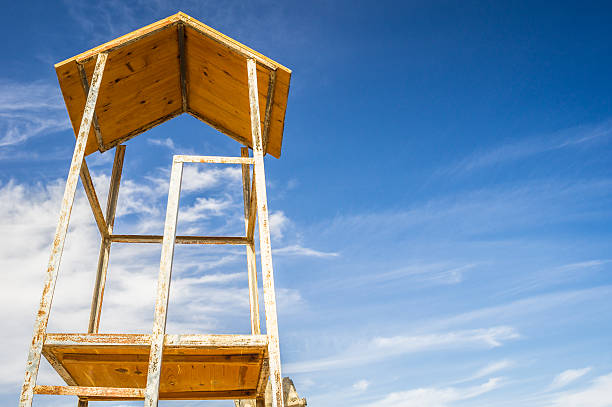 Lifeguard tower on sky background stock photo