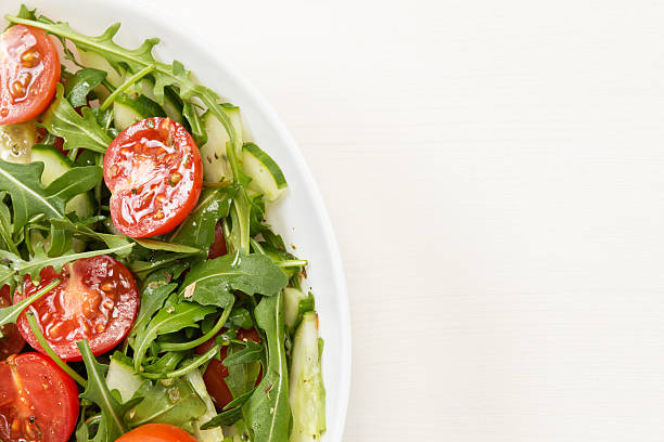 istock salad from ruccola, cherry tomatoes and cucumber 178771915
