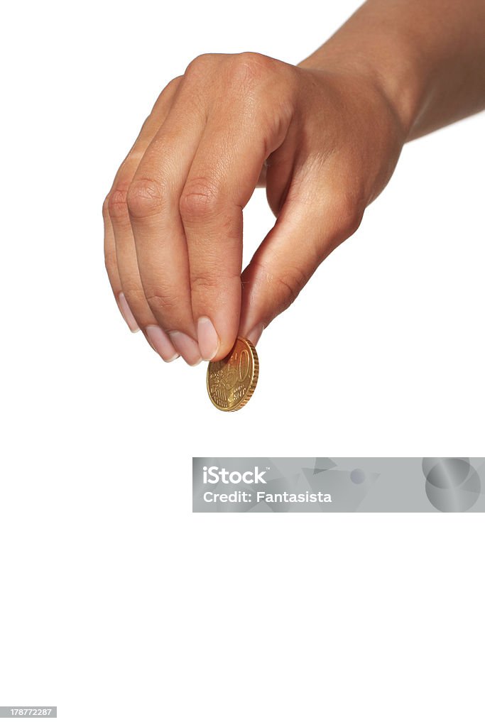 Hand with coin. Hand with coin isolated over white background. Adult Stock Photo