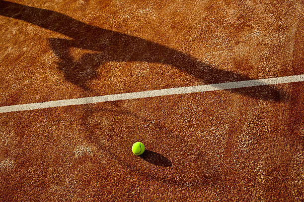 istock shadow of a tennis player in action 178772872