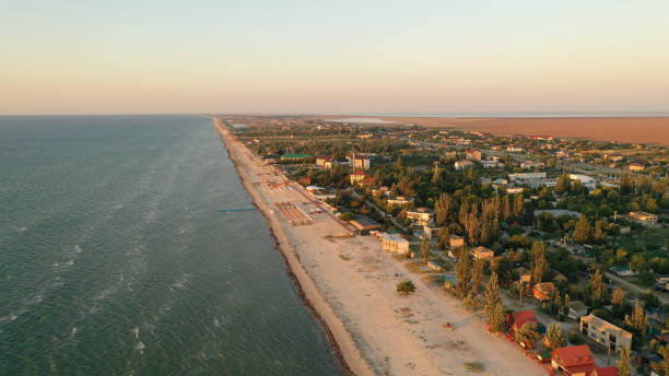 Panorama of sea shore in South Ukraine, Europe. Resort city with nice sand beach and clear blue sea. travel destination, ideal place for comfort vacation on black Sea. Drone photo Panorama of sea shore in South Ukraine, Europe. Resort city with nice sand beach and clear blue sea. travel destination, ideal place for comfort vacation on black Sea. Drone photo. odessa beach stock pictures, royalty-free photos & images