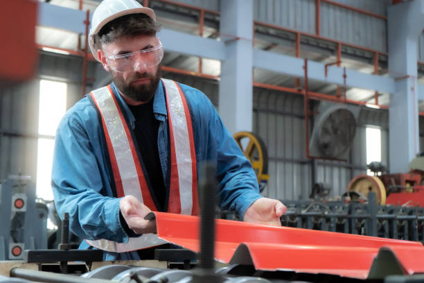 istock Young factory engineer performs maintenance on machinery. Quality check 1787759499