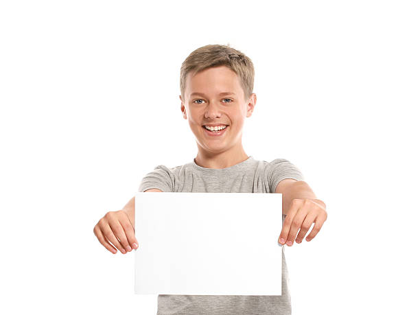 istock Smiling boy hold white blank paper 178776115