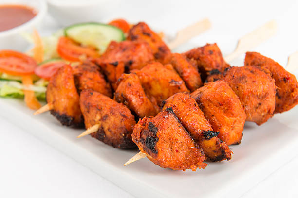 istock Three chicken tikka kebabs on a fancy plate 178776427