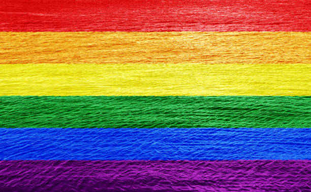 istock LGBT flag rainbow on water texture. Conceptual collage. 1787769758