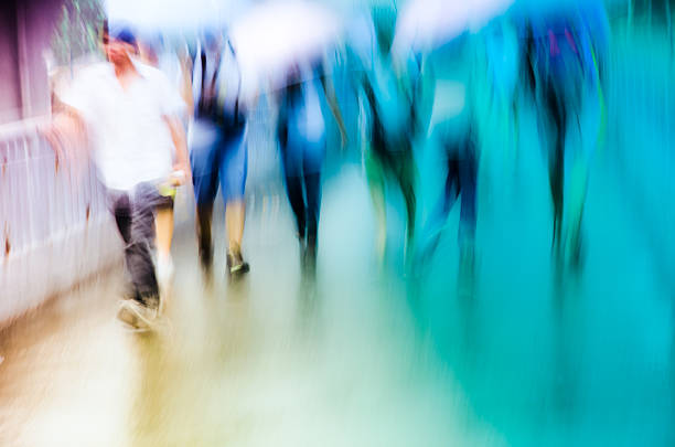 istock big city people walk on road in rainy day 178777066