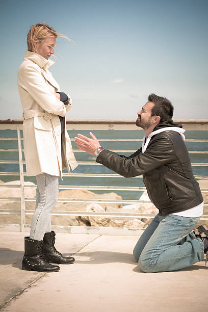 istock Man kneeling in front of girlfriend 178777215