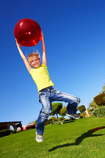 istock little girl playing in park. 178777313