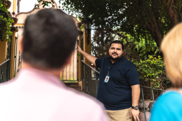 istock Private tourist guide explaining the place history to tourists 1787776725