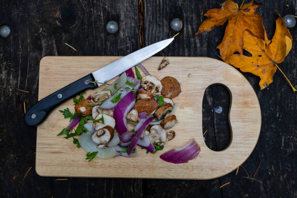 istock Chopped Onions and mushrooms on a cutting board 1787786262