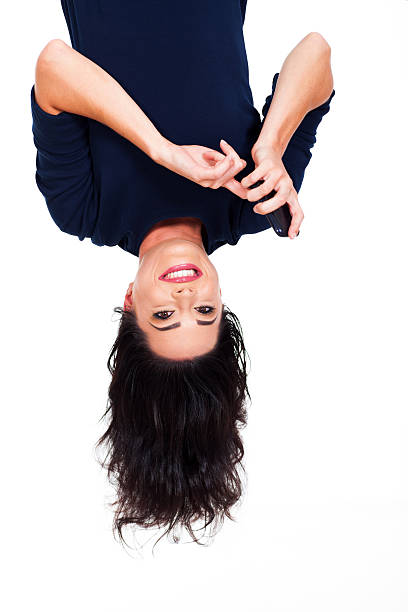 woman reading emails on smart phone upside down