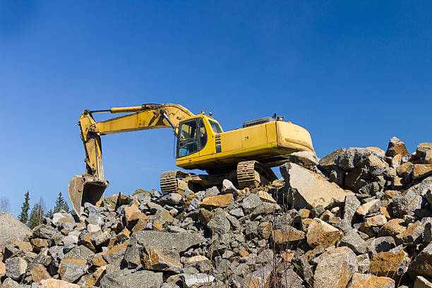 istock Yellow excavator at rock quarry 178779500