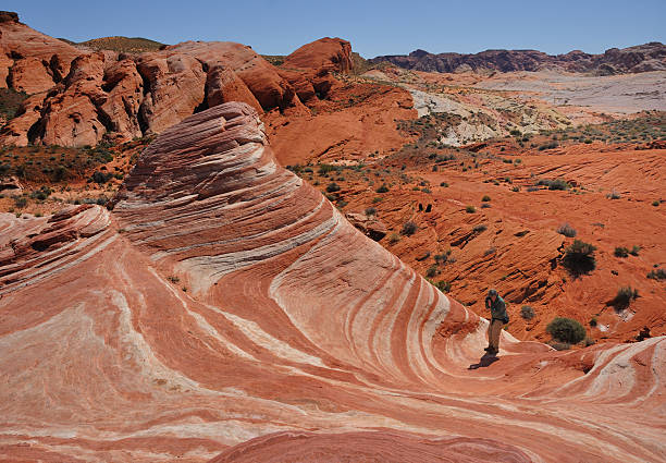 istock Man Taking a Photo of the Fire Wave Sandstone Formation 178779752