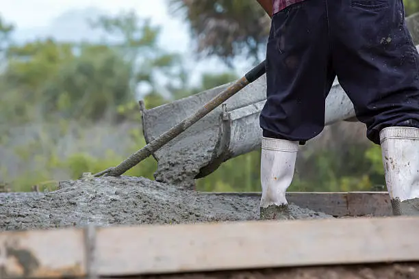 Cement truck  Pouring Patio, worker in boots