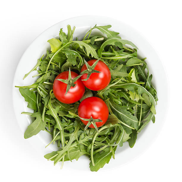 istock fresh rucola leaves in a bowl with tomatoes 178780018