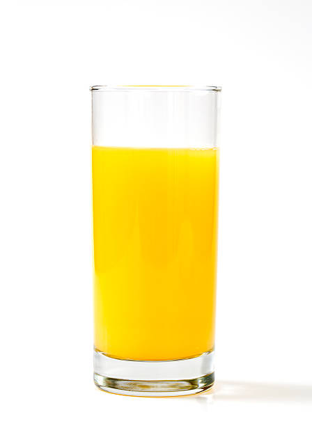 istock Glass of orange juice on flat table 178780411