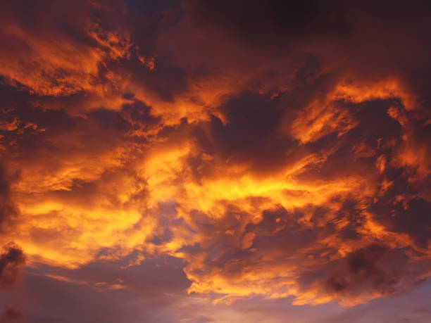 istock Dramatic sunset like fire in the sky with golden clouds 178780520