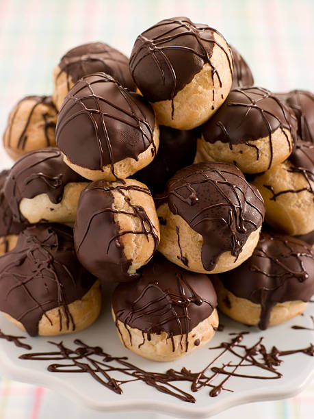 istock Chocolate Profiteroles on a Cake Stand 178780544